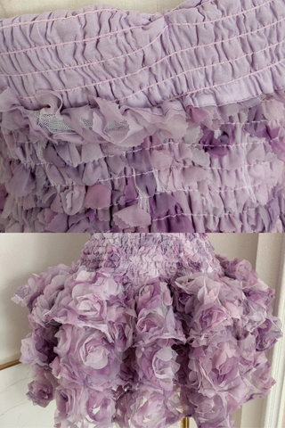 Strapless fitted mini dress with 3D floral ruffles and ruched bodice.