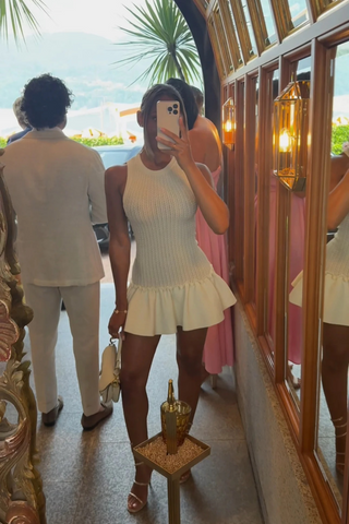 Sleeveless Knitted Mini Dress – Fitted Ribbed Bodice with Flared Ruffle Hem