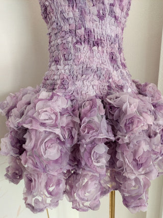 Strapless fitted mini dress with 3D floral ruffles and ruched bodice.