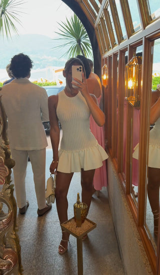 Sleeveless Knitted Mini Dress – Fitted Ribbed Bodice with Flared Ruffle Hem