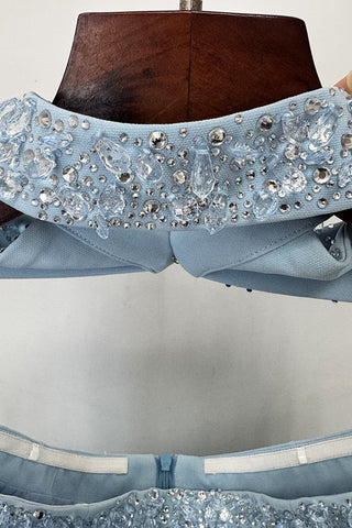 Crystal-Embellished Strapless Gown – Statement Neckline & Flowing Back Cape