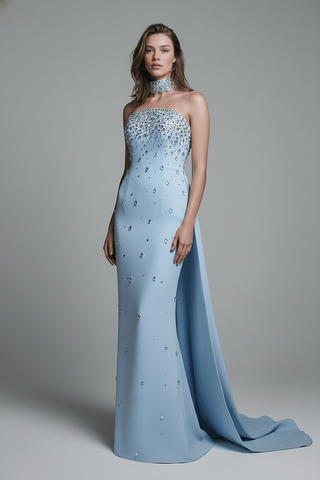 Crystal-Embellished Strapless Gown – Statement Neckline & Flowing Back Cape