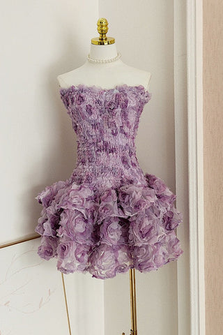 Strapless fitted mini dress with 3D floral ruffles and ruched bodice.