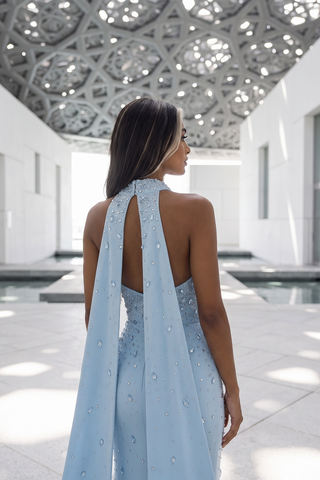 Crystal-Embellished Strapless Gown – Statement Neckline & Flowing Back Cape