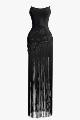 Nevo strapless black maxi dress featuring floral appliqué details and long cascading fringe on a bodycon silhouette.
